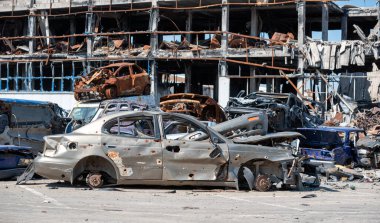 damaged and looted cars in a city in Ukraine during the war with Russia