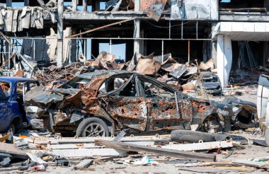 damaged and looted cars in a city in Ukraine during the war with Russia