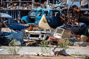 damaged and looted cars in a city in Ukraine during the war with Russia