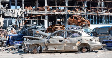 damaged and looted cars in a city in Ukraine during the war with Russia