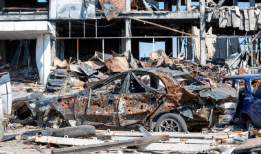 damaged and looted cars in a city in Ukraine during the war with Russia