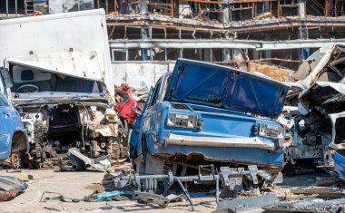 damaged and looted cars in a city in Ukraine during the war with Russia