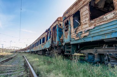burned out blown up wagons war between Russia and Ukraine