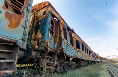 burned out blown up wagons war between Russia and Ukraine