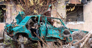 damaged and looted cars in a city in Ukraine during the war with Russia