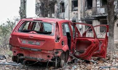 damaged and looted cars in a city in Ukraine during the war with Russia