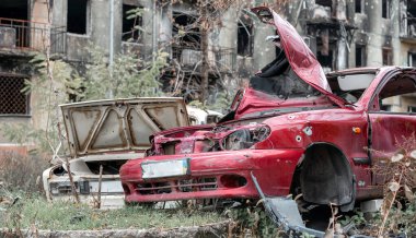 damaged and looted cars in a city in Ukraine during the war with Russia