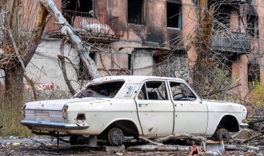 damaged and looted cars in a city in Ukraine during the war with Russia