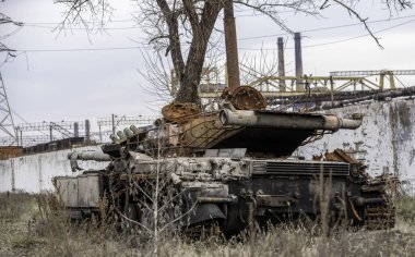 burnt tank and destroyed buildings of the Azovstal plant shop in Mariupol war in Ukraine with Russia