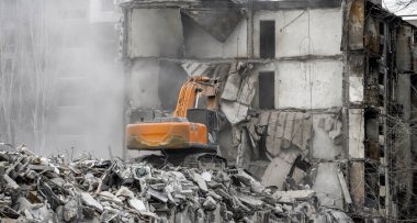 demolition of destroyed and burnt houses in Ukraine during the war with Russia