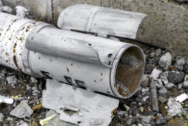 weapons rocket lying on the ground near the wall war in Ukraine with Russia