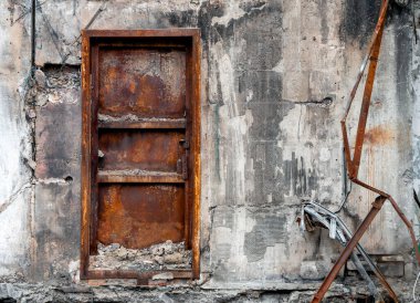 door and wall of destroyed and burnt house war in ukraine