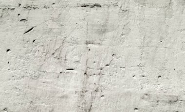 Boya kalıntıları ve çatlak arkaplan desenli eski taş duvar