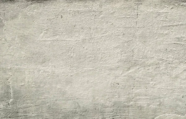 pattern old stone wall with paint residues and cracks background
