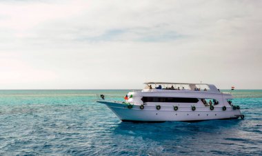 white cruise tourist boat on the background of the coast in the Red Sea in Sharm El Sheikh Egypt
