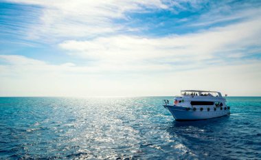 white cruise tourist boat on the background of the coast in the Red Sea in Sharm El Sheikh Egypt