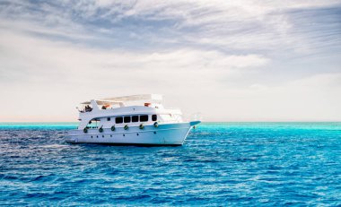 white cruise tourist boat on the background of the coast in the Red Sea in Sharm El Sheikh Egypt