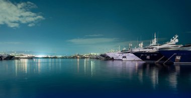 many ships at night on the pier without people in the Aegean Sea Athens Greece