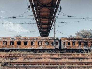 burned out blown up wagons war between Russia and Ukraine