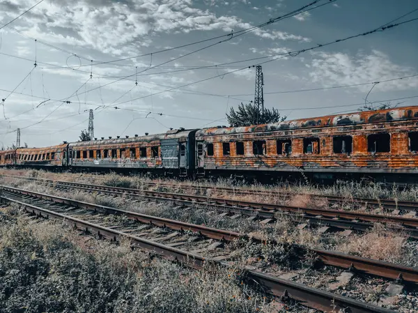 burned out blown up wagons war between Russia and Ukraine