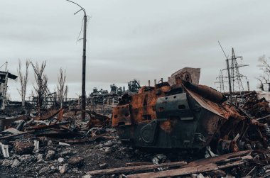 burnt tank and destroyed buildings of the Azovstal plant shop in Mariupol war in Ukraine with Russia