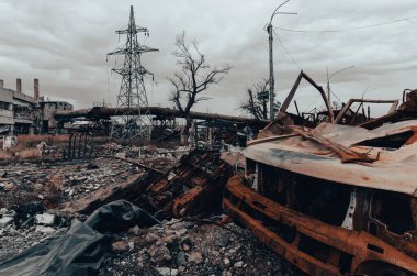 burnt cars and destroyed buildings of the workshop of the Azovstal plant in Mariupol war in Ukraine with Russia