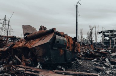 burnt tank and destroyed buildings of the Azovstal plant shop in Mariupol war in Ukraine with Russia