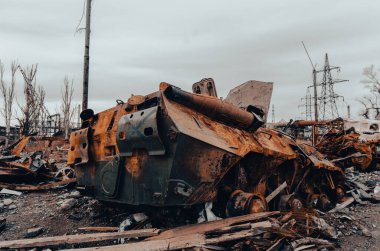 burnt tank and destroyed buildings of the Azovstal plant shop in Mariupol war in Ukraine with Russia