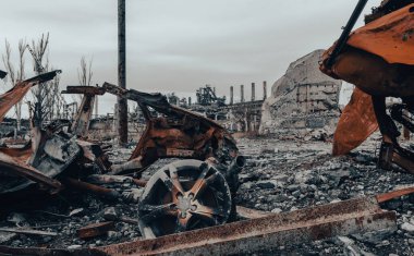 burnt cars and destroyed buildings of the workshop of the Azovstal plant in Mariupol war in Ukraine with Russia