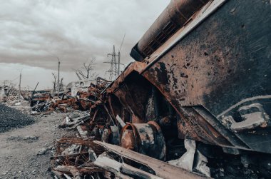 burnt tank and destroyed buildings of the Azovstal plant shop in Mariupol war in Ukraine with Russia