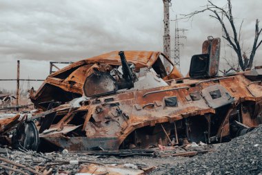 burnt tank and destroyed buildings of the Azovstal plant shop in Mariupol war in Ukraine with Russia