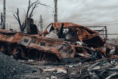 burnt tank and destroyed buildings of the Azovstal plant shop in Mariupol war in Ukraine with Russia