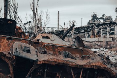 burnt tank and destroyed buildings of the Azovstal plant shop in Mariupol war in Ukraine with Russia