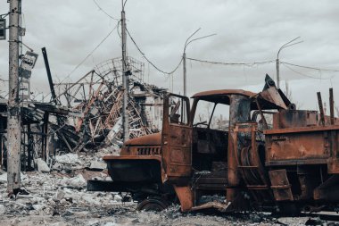 burnt cars and destroyed buildings of the workshop of the Azovstal plant in Mariupol war in Ukraine with Russia