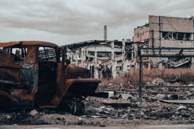 burnt cars and destroyed buildings of the workshop of the Azovstal plant in Mariupol war in Ukraine with Russia