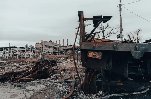 burnt cars and destroyed buildings of the workshop of the Azovstal plant in Mariupol war in Ukraine with Russia