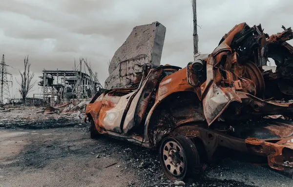 burnt cars and destroyed buildings of the workshop of the Azovstal plant in Mariupol war in Ukraine with Russia