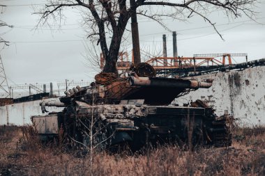 burnt tank and destroyed buildings of the Azovstal plant shop in Mariupol war in Ukraine with Russia