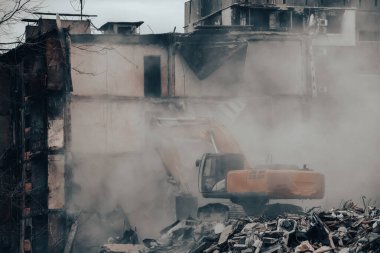 demolition of destroyed and burnt houses in Ukraine during the war with Russia