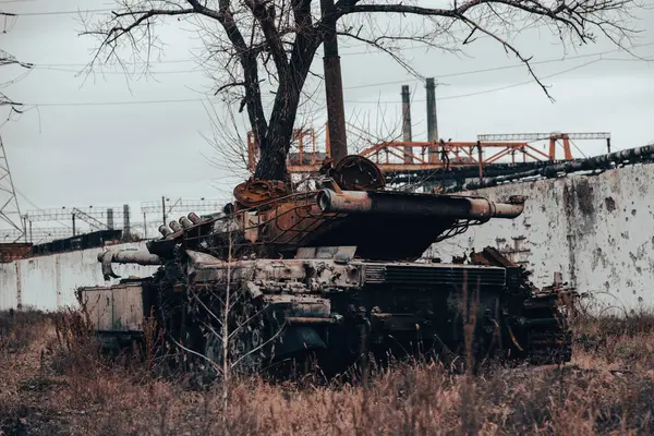 burnt tank and destroyed buildings of the Azovstal plant shop in Mariupol war in Ukraine with Russia