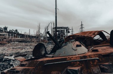 burnt tank and destroyed buildings of the Azovstal plant shop in Mariupol war in Ukraine with Russia