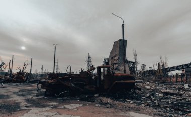 burnt cars and destroyed buildings of the workshop of the Azovstal plant in Mariupol war in Ukraine with Russia