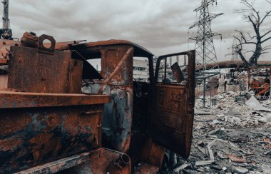 burnt cars and destroyed buildings of the workshop of the Azovstal plant in Mariupol war in Ukraine with Russia