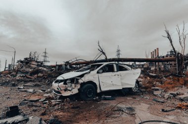 burnt cars and destroyed buildings of the workshop of the Azovstal plant in Mariupol war in Ukraine with Russia