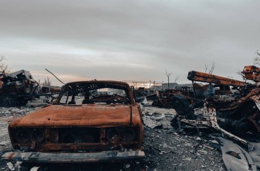 burnt cars and destroyed buildings of the workshop of the Azovstal plant in Mariupol war in Ukraine with Russia