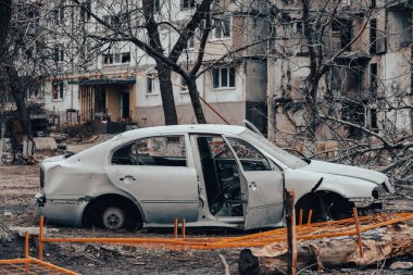 damaged and looted cars in a city in Ukraine during the war with Russia