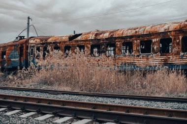 burned out blown up wagons war between Russia and Ukraine
