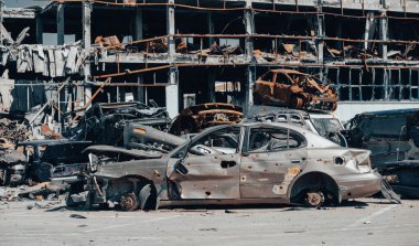 damaged and looted cars in a city in Ukraine during the war with Russia