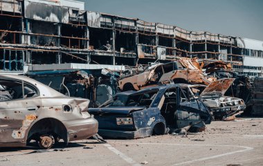 damaged and looted cars in a city in Ukraine during the war with Russia