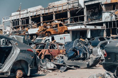 damaged and looted cars in a city in Ukraine during the war with Russia